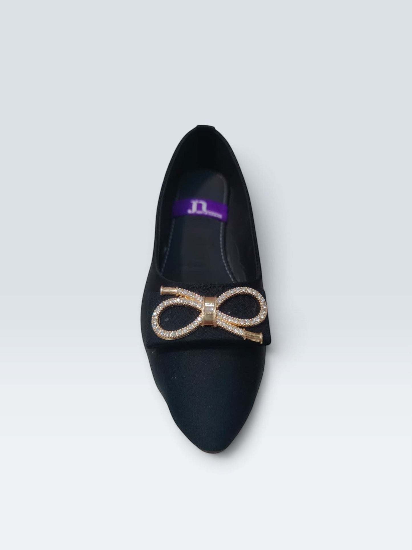 My Store 2 black satin pointed-toe ballet flats featuring a sparkling crystal-embellished bow detail on the toe.
