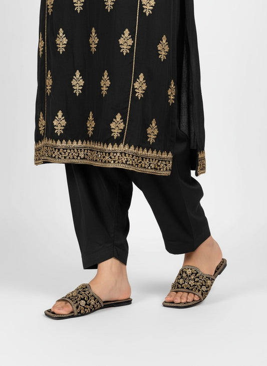 My Store 2 black velvet flat slide sandals with intricate gold floral embroidery and stone accents on a model