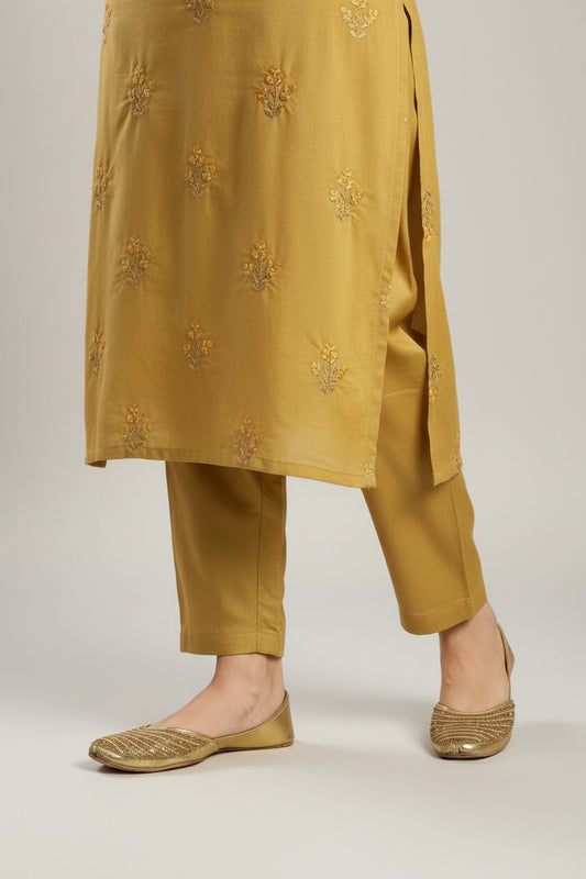 My Store 2 gold embellished traditional jutti flats worn with a matching mustard embroidered ethnic kurta set
