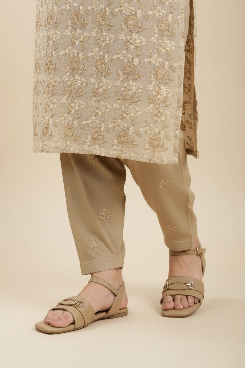 My Store 2 beige square-toe flat sandals with ankle strap and metallic buckle detail worn with embroidered trousers