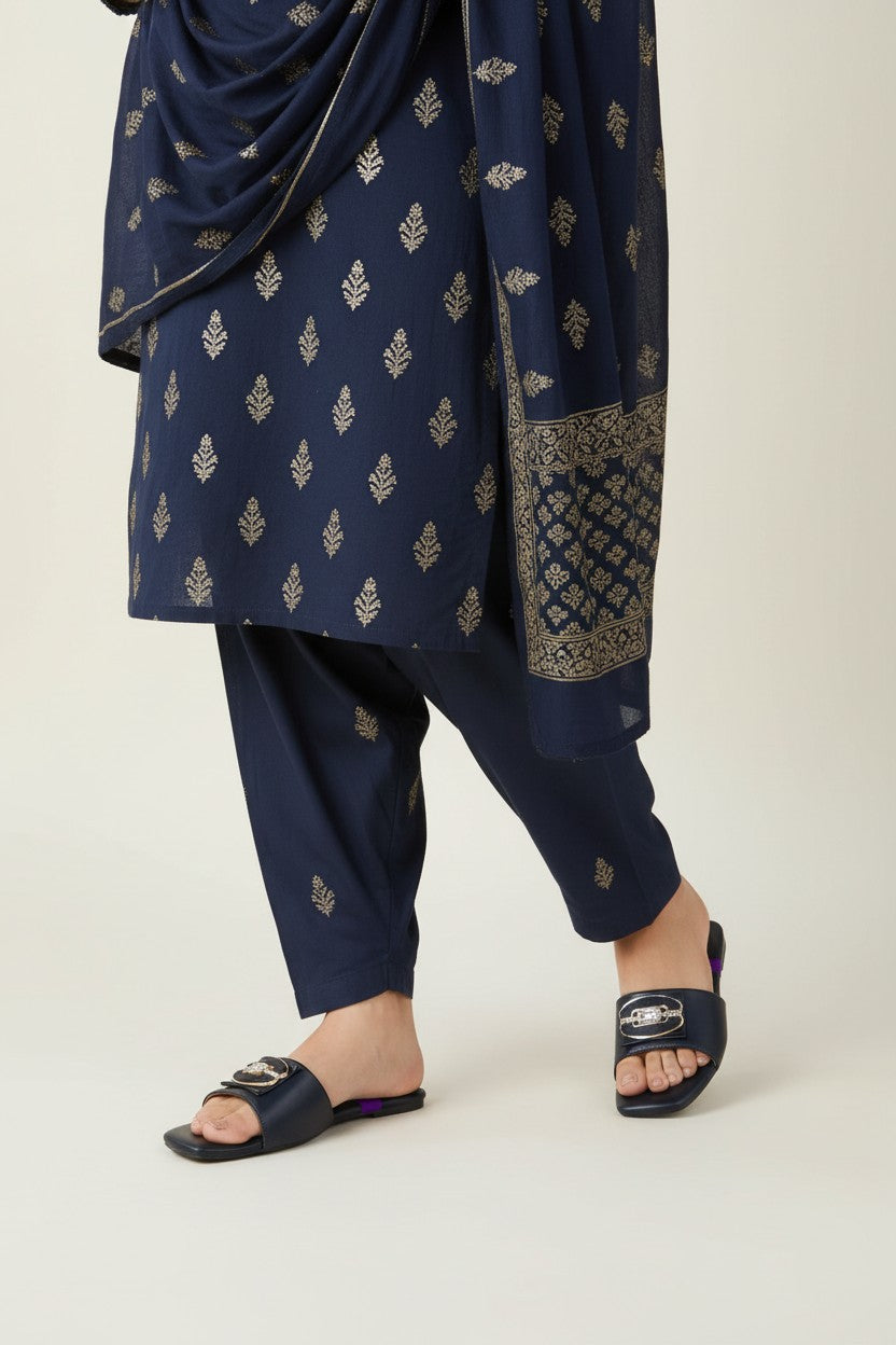 My Store 2 black slide sandals with gold crystal buckle worn with a navy blue printed kurta set