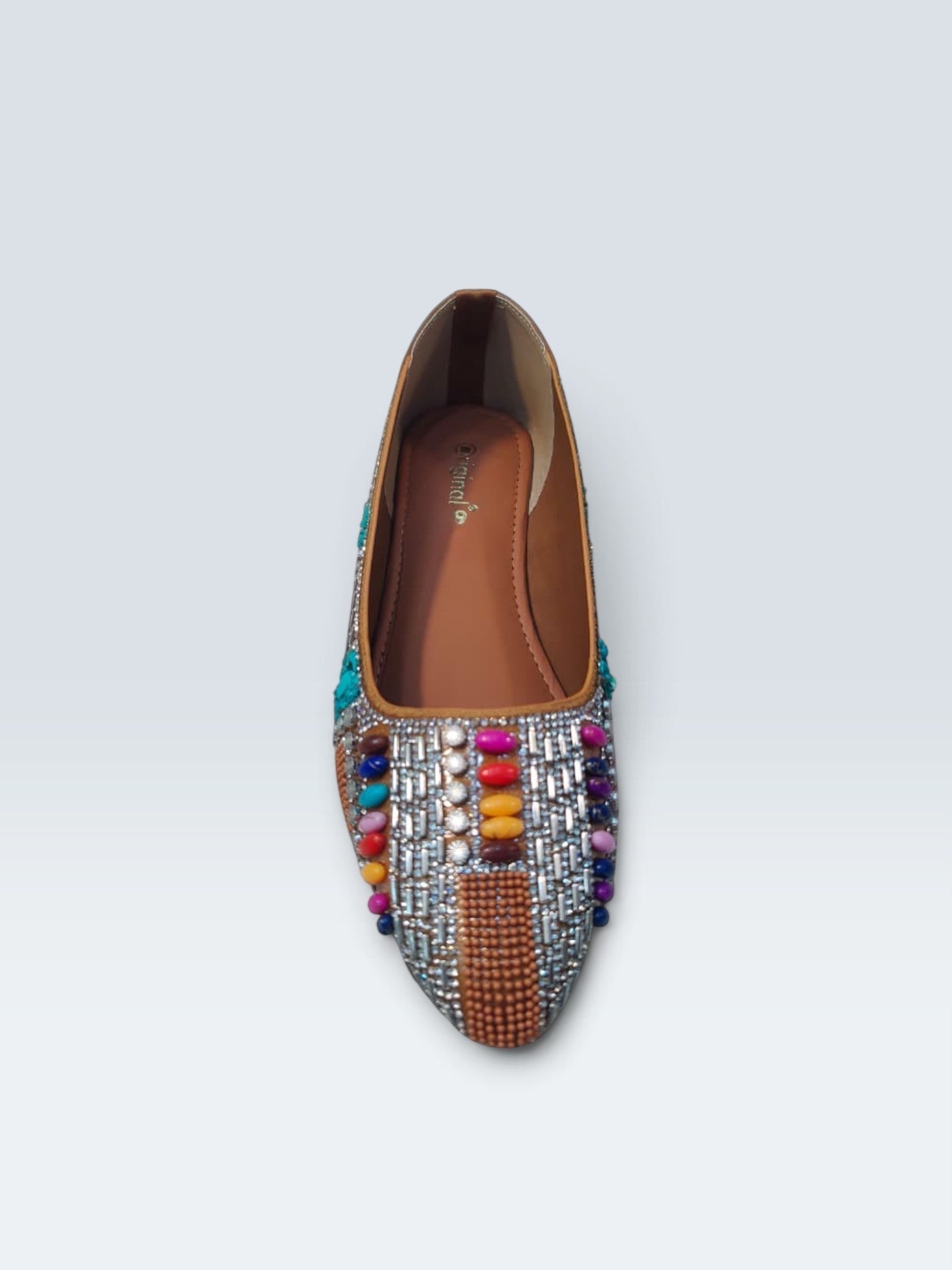 My Store 2 tan embellished flats featuring turquoise stones, crystals, and multi-colored beads in a traditional design.