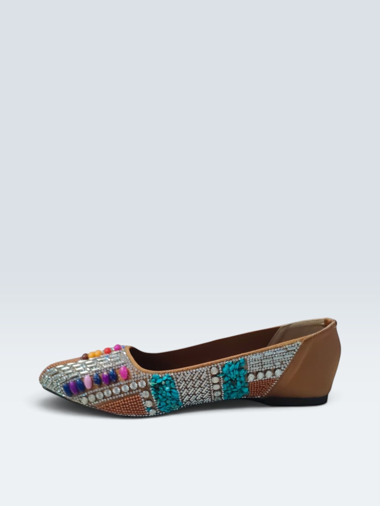 My Store 2 tan embellished flats featuring turquoise stones, crystals, and colorful beads in a traditional design.