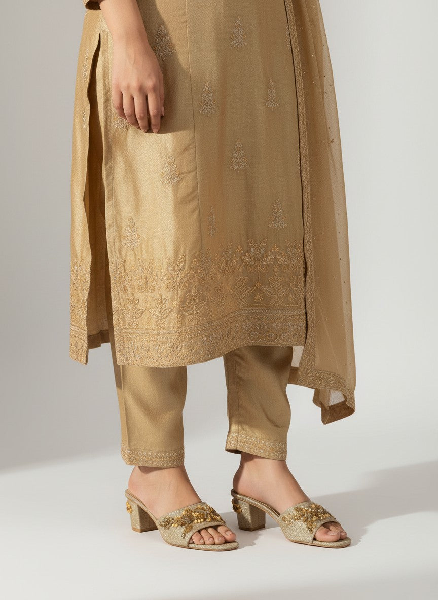 My Store 2 gold glitter block heel slide sandals with crystal and bead embellishments worn with a matching ethnic outfit