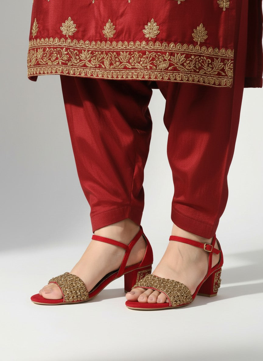 My Store 2 red velvet block heel sandals with gold rhinestone embellishments worn with matching red embroidered pants