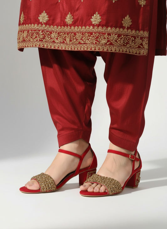 My Store 2 red velvet block heel sandals with gold rhinestone embellishments worn with matching red embroidered pants